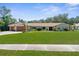 Charming single-story home with a well-manicured lawn and inviting curb appeal at 4603 Lake In The Woods Dr, Spring Hill, FL 34607
