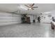 Spacious three car garage with epoxy floor and plenty of storage space at 4603 Lake In The Woods Dr, Spring Hill, FL 34607