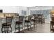 Kitchen bar with seating and a view of the backyard at 4603 Lake In The Woods Dr, Spring Hill, FL 34607
