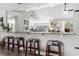 Open-concept living room with breakfast bar overlooking the living area and open floor plan at 4603 Lake In The Woods Dr, Spring Hill, FL 34607