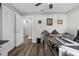 Well-lit office featuring luxury vinyl flooring, a ceiling fan, a closet, and large desk at 4603 Lake In The Woods Dr, Spring Hill, FL 34607