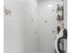 Tiled shower space featuring tile and a convenient built-in storage shelf at 4603 Lake In The Woods Dr, Spring Hill, FL 34607