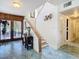 View of the foyer with staircase, wood trim and tiled floor at 4929 N River Shore Dr # A, Tampa, FL 33603