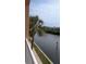 Scenic balcony view showcasing lush greenery, and a tranquil river at 5000 Culbreath Key Way # 9-221, Tampa, FL 33611