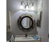 Bathroom with a decorative mirror, vanity with sink, and modern lighting at 5000 Culbreath Key Way # 9-221, Tampa, FL 33611