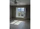 Bright bedroom featuring wood-look tile, shuttered windows and plenty of natural light at 5000 Culbreath Key Way # 9-221, Tampa, FL 33611