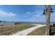Scenic waterfront property featuring a charming walkway with bay views and lush landscaping at 5000 Culbreath Key Way # 9-221, Tampa, FL 33611