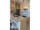 Modern kitchen features stainless steel appliances, elegant countertops, and white cabinetry at 5000 Culbreath Key Way # 9-221, Tampa, FL 33611