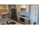Well-lit kitchen with stainless steel appliances, ample cabinetry, and modern countertop space at 5000 Culbreath Key Way # 9-221, Tampa, FL 33611