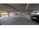 Well-lit and spacious parking garage with multiple vehicles and visible support columns at 5000 Culbreath Key Way # 9-221, Tampa, FL 33611