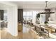 Open-concept living space with balcony access, natural light, and modern furnishings at 5015 Us Highway 19 # 501, New Port Richey, FL 34652