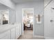 Stylish bathroom with a view into a cozy bedroom featuring a walk-in shower at 625 171St E St, Bradenton, FL 34212