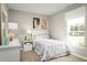Bright bedroom features llama-themed decor, white furniture, and a sunny window at 625 171St E St, Bradenton, FL 34212