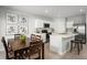 Dining space featuring a table set for six, adjacent to the kitchen and bathed in natural light at 625 171St E St, Bradenton, FL 34212