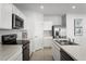 Well-equipped kitchen showcasing stainless steel appliances and white cabinets in a modern design at 625 171St E St, Bradenton, FL 34212