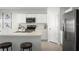 Bright kitchen with white cabinetry, stainless steel appliances, and a spacious center island with seating at 625 171St E St, Bradenton, FL 34212