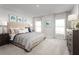 Spacious main bedroom with large windows, soft decor, and a dresser at 625 171St E St, Bradenton, FL 34212