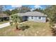 Attractive one-story home featuring a well-maintained yard and a tidy landscape at 7399 Skylark Dr, Spring Hill, FL 34606