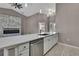 Stylish kitchen featuring bright cabinets, stainless steel appliances, and an open layout at 7399 Skylark Dr, Spring Hill, FL 34606