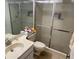 The bathroom has a shower, toilet, sink and a vanity at 8150 Braddock Cir # 4, Port Richey, FL 34668