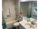 Bathroom with shower, bathtub, toilet, and vanity at 8150 Braddock Cir # 4, Port Richey, FL 34668