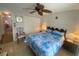 Bedroom with ceiling fan, tile floors, queen bed, and closet at 8150 Braddock Cir # 4, Port Richey, FL 34668