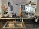 View over the breakfast bar into the spacious living room, seamlessly connecting the spaces at 8150 Braddock Cir # 4, Port Richey, FL 34668