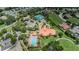 Community aerial view showcasing tennis courts, a pool, and manicured landscaping at 10309 Altrara Way, Trinity, FL 34655