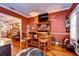 Stylish bar area with custom finishes, hardwood floors, and comfortable seating at 1031 Pomme De Pin Ln, New Port Richey, FL 34655