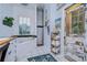 Charming bathroom features a soaking tub, separate shower, and unique decorative touches at 1031 Pomme De Pin Ln, New Port Richey, FL 34655