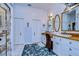 Bright and airy bathroom with dual vanities, nautical decor, and ample storage space at 1031 Pomme De Pin Ln, New Port Richey, FL 34655