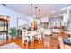 Open-concept dining room with hardwood floors and view of the gourmet kitchen at 1031 Pomme De Pin Ln, New Port Richey, FL 34655