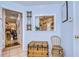 Charming entryway features a vintage trunk, decorative accents, and a view into the living area at 1031 Pomme De Pin Ln, New Port Richey, FL 34655