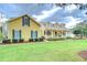 Charming two-story home with inviting front porch and well-manicured lawn at 1031 Pomme De Pin Ln, New Port Richey, FL 34655