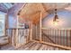 Unique hallway with rustic wood details, brick accents, and artistic lighting fixtures at 1031 Pomme De Pin Ln, New Port Richey, FL 34655