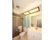 Bathroom featuring a shower, vanity, toilet, framed light and curtain at 10800 Cedar Breaks Dr, Port Richey, FL 34668