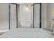 Serene bathroom featuring a soaking tub showcased through black framed doors and sheer curtains at 11151 Lu Wista Ln, Brooksville, FL 34601