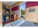 Bedroom with neutral-toned walls and patterned bedding and a window with natural light at 11151 Lu Wista Ln, Brooksville, FL 34601