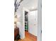 Hallway leading to a closet with unique galaxy-themed interior, next to the staircase at 11151 Lu Wista Ln, Brooksville, FL 34601