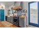 Well-equipped kitchen with butcher block countertops, modern appliances, and a blue accent door at 11151 Lu Wista Ln, Brooksville, FL 34601
