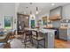 Well-lit kitchen features a large island, pendant lights, stainless steel appliances, and stylish cabinetry at 11151 Lu Wista Ln, Brooksville, FL 34601