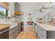 Modern kitchen featuring a farmhouse sink, butcher block countertops, and stainless steel appliances at 11151 Lu Wista Ln, Brooksville, FL 34601
