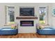 Cozy living room featuring a modern fireplace, tv, and comfortable seating at 11151 Lu Wista Ln, Brooksville, FL 34601