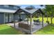 Outdoor space featuring a gazebo with outdoor dining and seating on a well manicured lawn at 11151 Lu Wista Ln, Brooksville, FL 34601