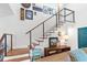 Modern staircase featuring wood treads and railings, with white walls, and stylish decor at 11151 Lu Wista Ln, Brooksville, FL 34601