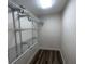 Walk-in closet includes wood floors and silver adjustable shelving at 1162 58Th N Ave, St Petersburg, FL 33703