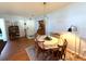 Classic dining area with wood table, chairs, hardwood floors, and unique decor at 11737 Spring Tree Ln, Port Richey, FL 34668