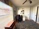 Well-lit home office with a large window and built-in storage at 11737 Spring Tree Ln, Port Richey, FL 34668