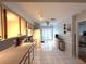 Well-lit kitchen features tile flooring and direct access to the backyard at 11737 Spring Tree Ln, Port Richey, FL 34668
