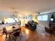 Open concept living area with adjacent dining space at 11737 Spring Tree Ln, Port Richey, FL 34668